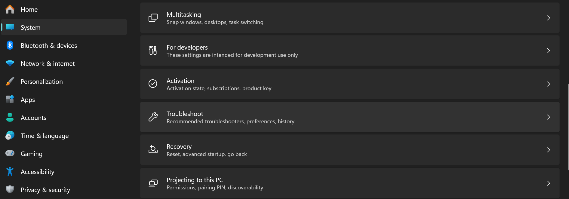 The main panel is focused on the System category, showing various options including, multitasking, activation, troubleshoot, recovery, for developers and projecting ths to PC.