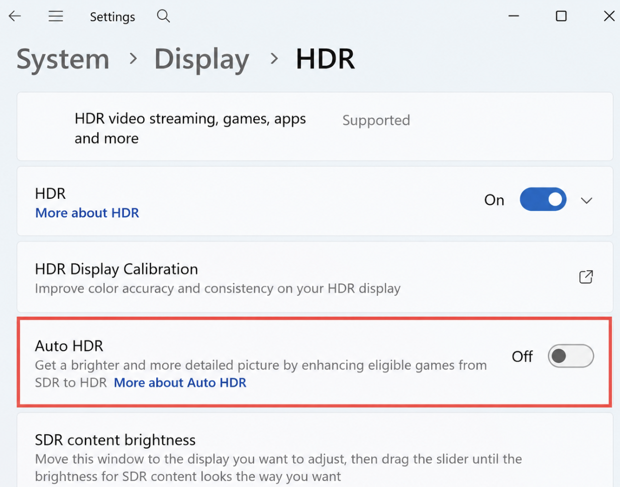 Windows 11 HDR settings with the Auto HDR option highlighted in red and switched off.